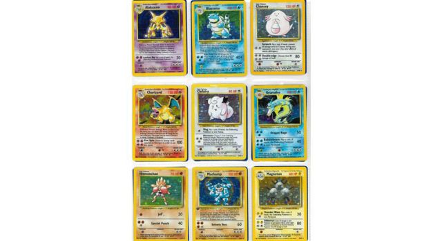 Collection of Pokémon Base Set holographic cards including Charizard, Blastoise, Alakazam, Chansey, Gyarados, Machamp, Clefairy, Hitmonchan and Magneton.